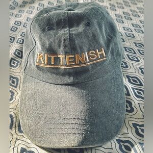 Kittenish blue-gray denim cap.
